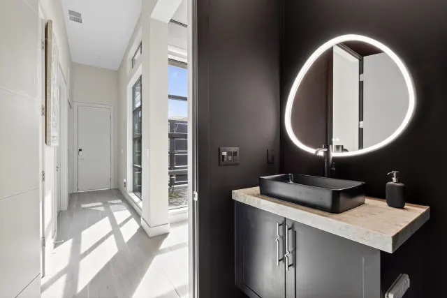Remodeled bathroom with custom tile by LV Lux Construction